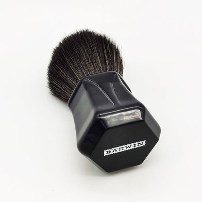 Black synthetic Darwin Shaving Brush by Pasteur Pharmacy with dense bristles and a sleek handle for a smooth shave.