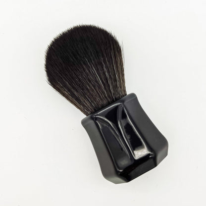 Darwin Black Synthetic Shaving Brush by Pasteur Pharmacy with dense bristles and sleek handle for smooth shaving.