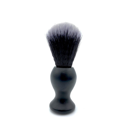 Dural heavy-duty brass shaving brush by Pasteur Pharmacy with vegan eco-friendly bristles, designed for a smooth shaving experience.