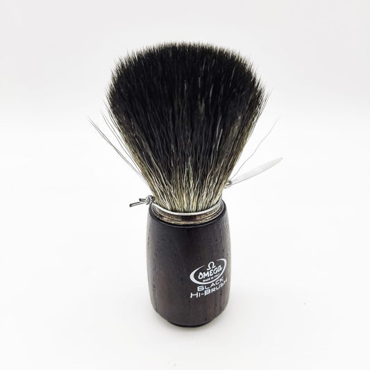 Omega shaving brush with synthetic fiber bristles, designed for a smooth shave, featuring a classic handle and detailed brush head.