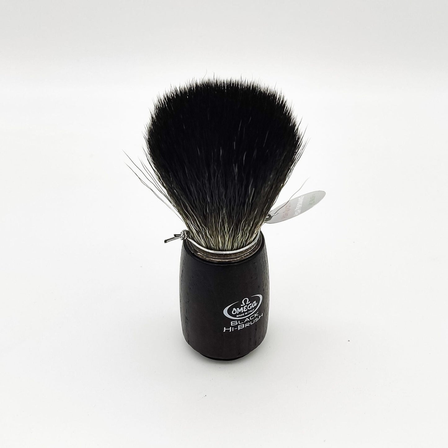 Omega shaving brush with synthetic fiber bristles, featuring a wooden handle, designed for a smooth shaving experience.