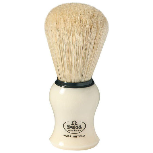 Omega shaving brush with mock ivory handle, Pasteur Pharmacy brand, close-up of the classic grooming tool.