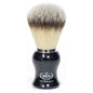 Omega synthetic nylon shaving brush with a carbon fiber look, featuring a dense bristle knot and sleek black handle.