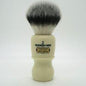 Simpson Captain 2 Sovereign Grade synthetic fiber shaving brush with a black handle and soft bristles, ideal for a close shave.