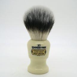 Simpson Commodore X1 Sovereign Grade synthetic fiber shaving brush with cream-colored handle and dense bristles.