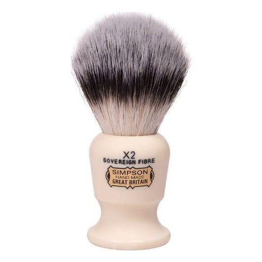 Simpson Commodore X2 Sovereign Grade synthetic fiber shaving brush with a black handle and dense bristle knots.