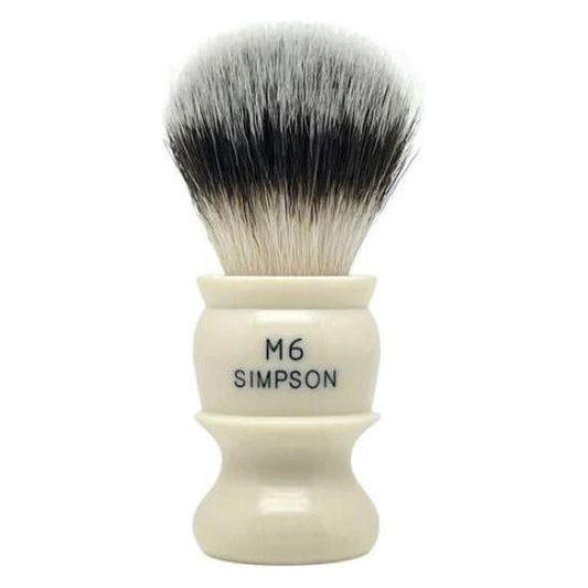 Simpson M6 Sovereign synthetic fibre shaving brush with white handle and dense bristles, designed for a close, comfortable shave.