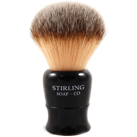 Synthetic Stirling Soap Co. shaving brush with a black handle and dense synthetic bristles for a smooth shave.