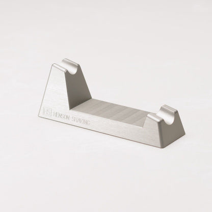 Henson Shaving Razor Stand by Pasteur Pharmacy holding a shaving razor for display or storage.