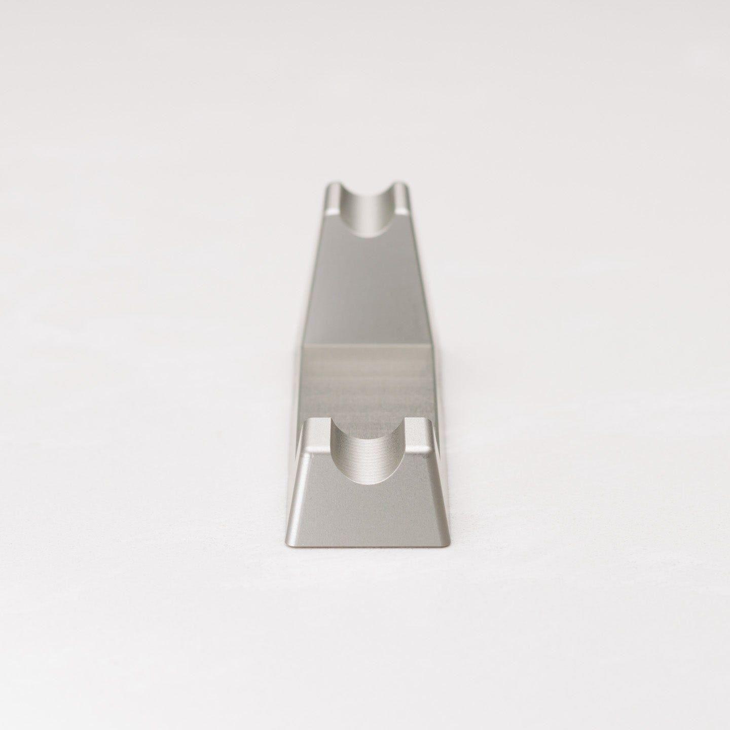 Henson Shaving Razor Stand by Pasteur Pharmacy holding a shaving razor on a clean countertop.