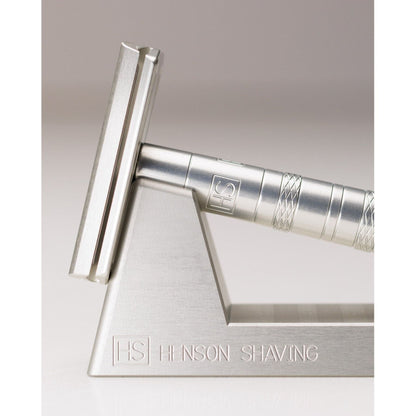Henson Shaving Razor Stand by Pasteur Pharmacy holding a modern safety razor for organized grooming.