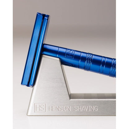 Henson Shaving Razor Stand by Pasteur Pharmacy holding a shaving razor and brush for organized grooming.