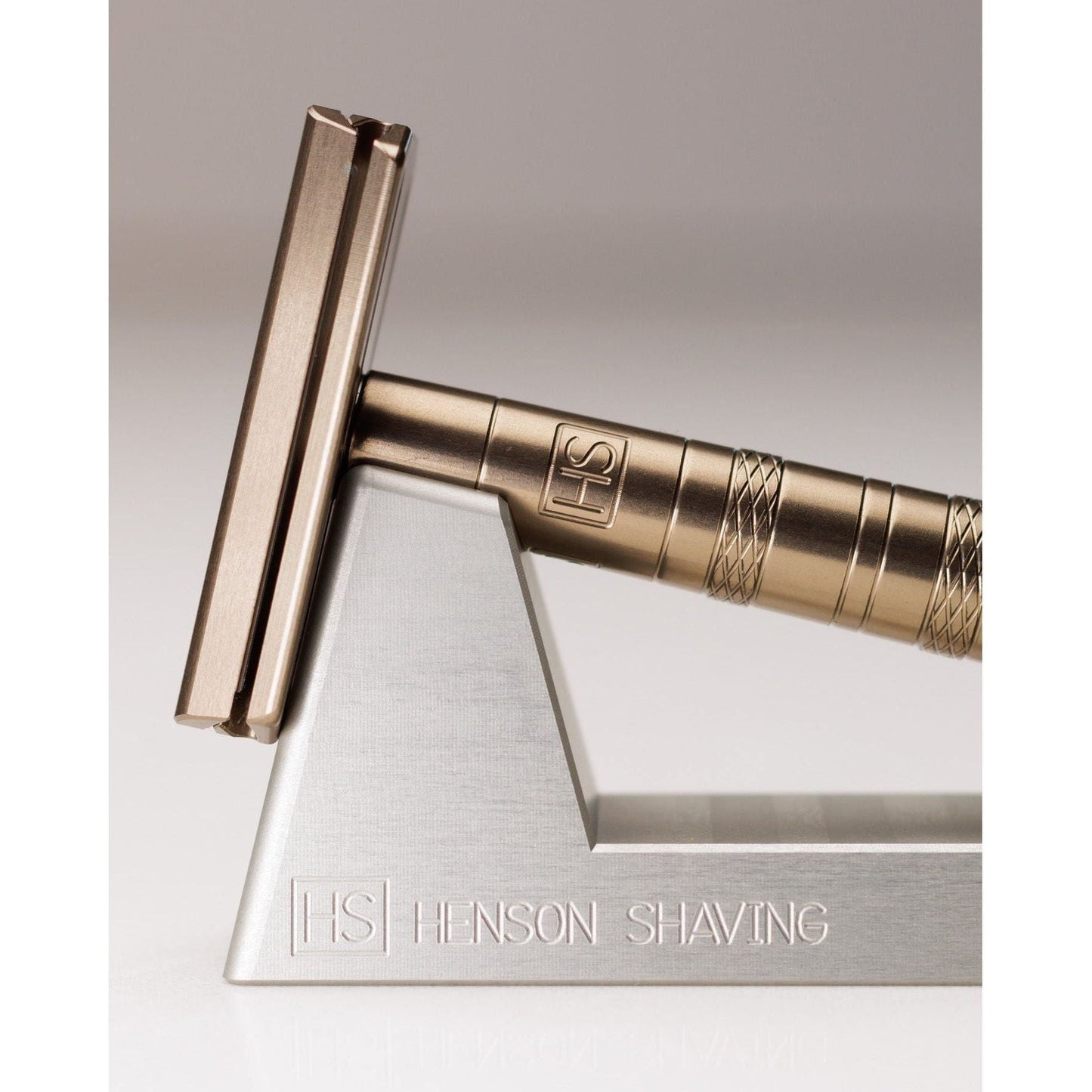 Henson Shaving Razor Stand by Pasteur Pharmacy holding a shaving razor for organized grooming.