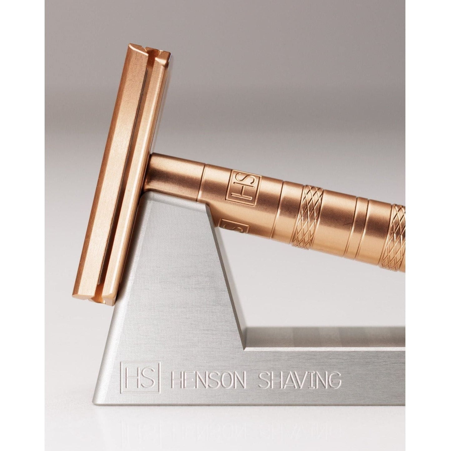 Henson Shaving Razor Stand by Pasteur Pharmacy holding a shaving razor on a clean countertop.