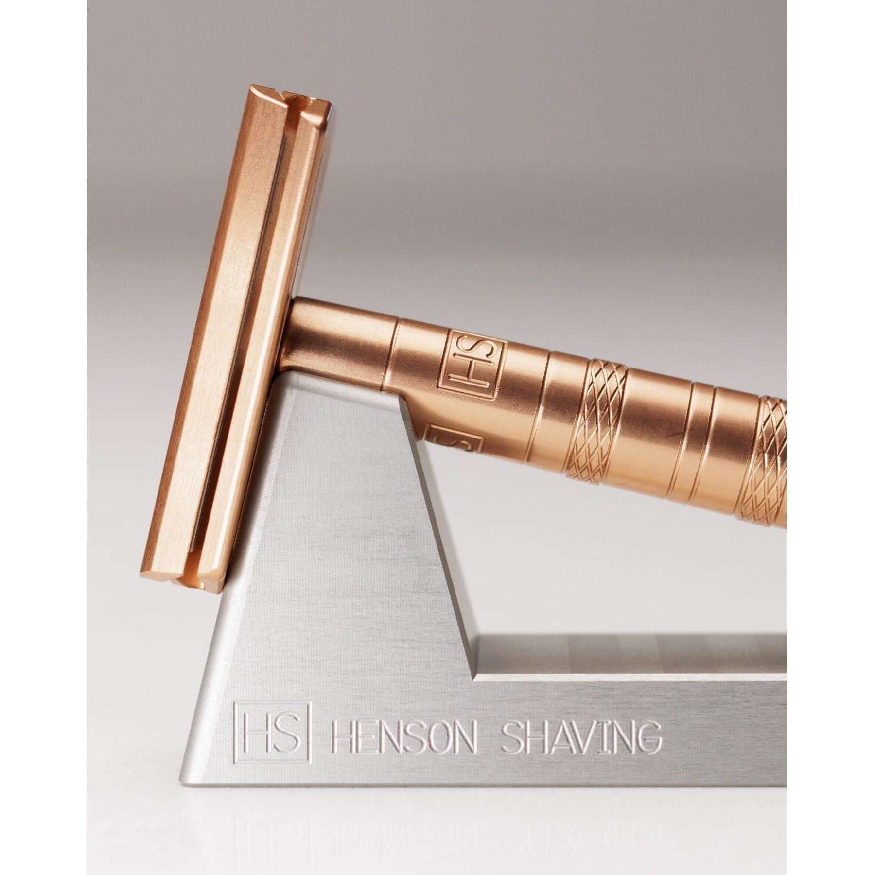 Henson Shaving Razor Stand by Pasteur Pharmacy holding a shaving razor on a clean countertop.