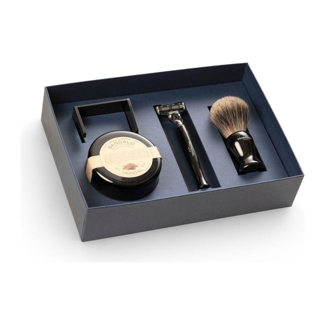 Mondial 4-piece wet shaving set with ebony resin brush, razor, bowl, and stand, featuring bergamot and neroli scent details.