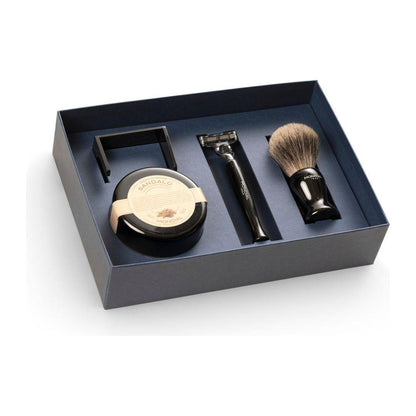 Mondial 4-piece wet shaving set with ebony resin brush, razor, bowl, and stand, featuring bergamot and neroli scent details.