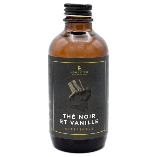 Noble Otter Soap Co. The Noir Et Vanille shaving set with soap, brush, and accessories in a sleek grooming collection.