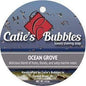 Shaving set with Ocean Grove soap by Catie's Bubbles, including a 4oz shaving soap and accessories, displayed on a clean surface.