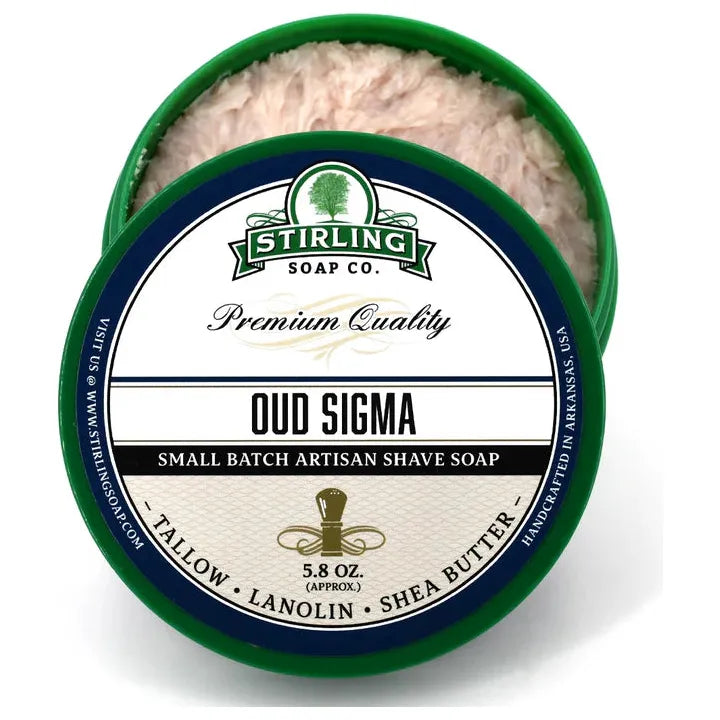 Shaving set with Stirling Soap Co. Oud Sigma soap, shaving brush, and accessories in a stylish collection for grooming.