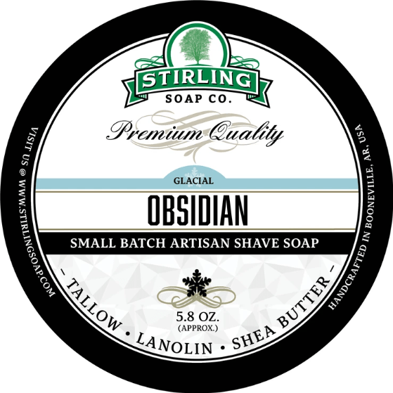 Stirling Soap Co. Glacial Obsidian shaving set with soap, brush, and accessories in a sleek grooming collection.