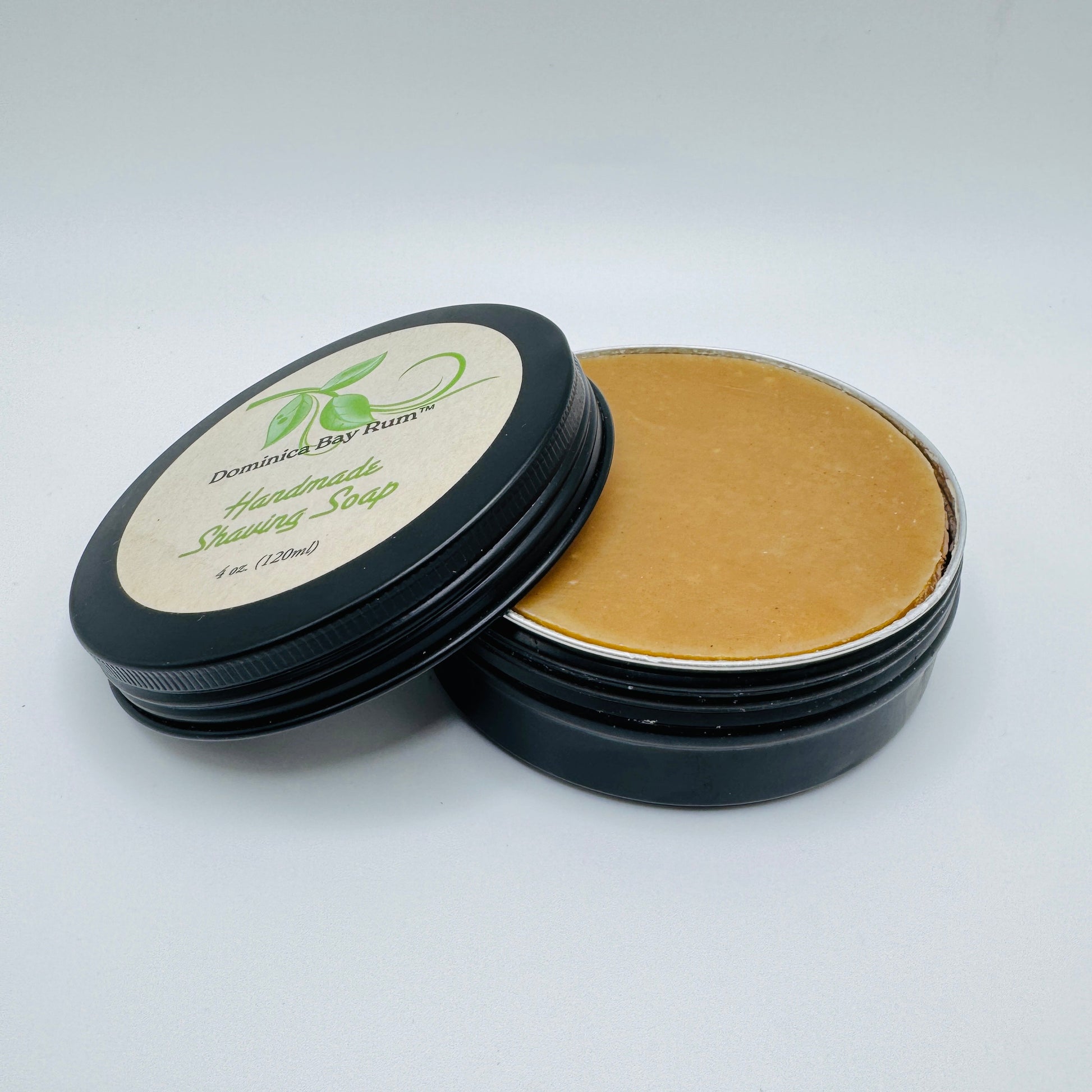 Pasteur Pharmacy Dominica Bay Rum Handmade Shaving Soap in a 4 oz container, showcasing its natural, creamy texture and packaging.