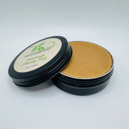 Pasteur Pharmacy Dominica Bay Rum Handmade Shaving Soap in a 4 oz container, showcasing its natural, creamy texture and packaging.