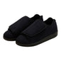 Black Silverts slippers by Pasteur Pharmacy, size 12, 2X-wide, comfortable slip-on shoes with soft fabric and sturdy soles.