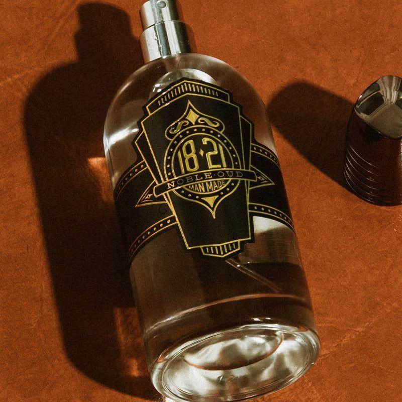 18.21 Man Made Noble Oud Spirits skin care product in 3.4 oz bottle, featuring elegant packaging with Oud fragrance design.