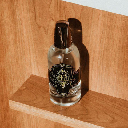 18.21 Man Made Noble Oud Spirits skin care product in a 3.4 oz bottle, featuring a sleek design and elegant packaging.