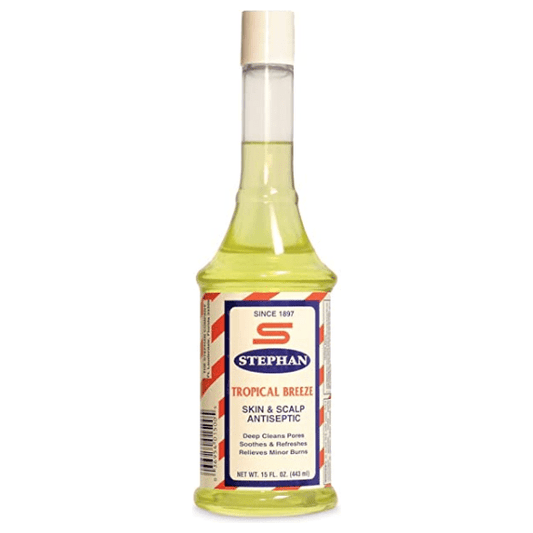 Stephan Tropical Breeze Skin & Scalp Antiseptic bottle from Pasteur Pharmacy, 15 oz size, with label showing tropical scent and product details.