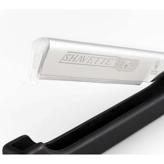 Dovo Shavette straight razor with black handle, designed for precise shaving, featuring a sleek black handle and professional craftsmanship.