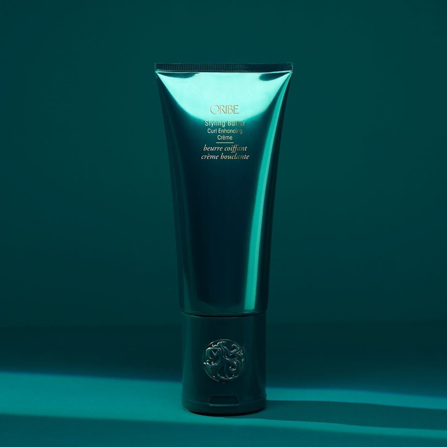 Oribe Styling Butter Curl Enhancing Crème in a jar, creamy styling cream for defined, bouncy curls.