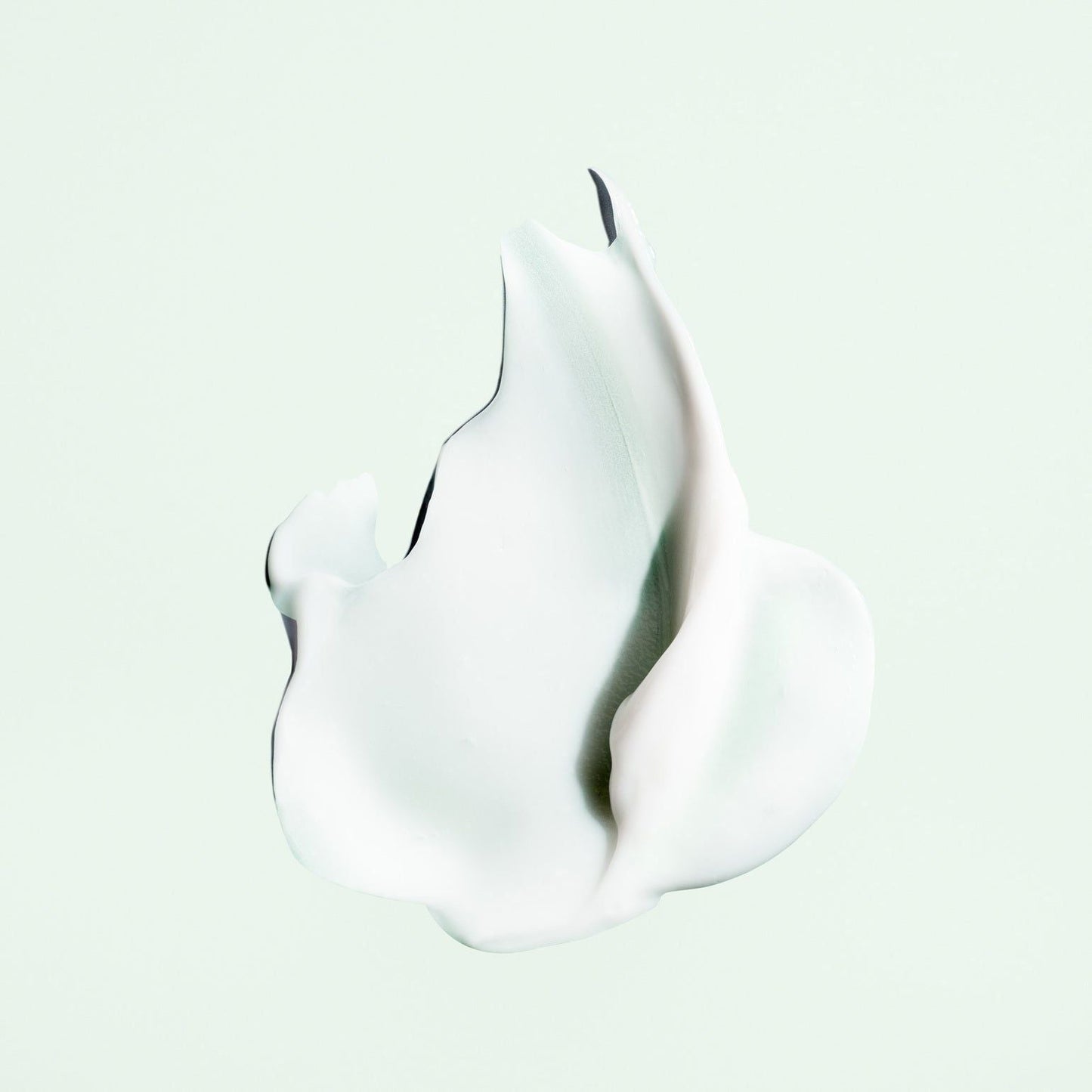Oribe Styling Butter Curl Enhancing Crème in a jar, showing the creamy texture of this styling cream for curls and waves.