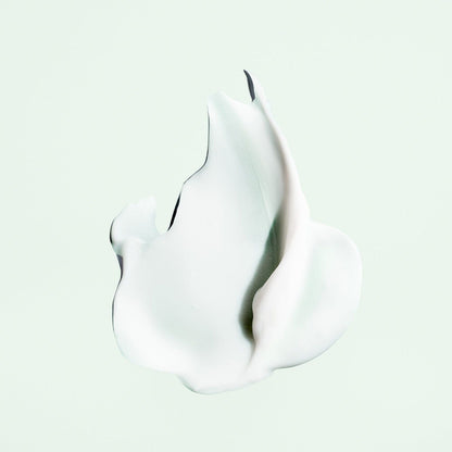 Oribe Styling Butter Curl Enhancing Crème in a jar, showing the creamy texture of this styling cream for curls and waves.