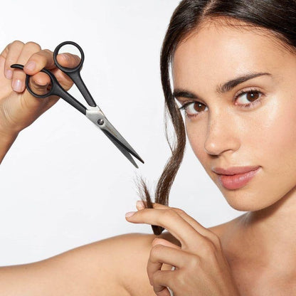 Tweezerman Spirit 2000 5.5-inch styling shears with 0.3 blade for precise hair cutting, shown with stainless steel blades and ergonomic handle.