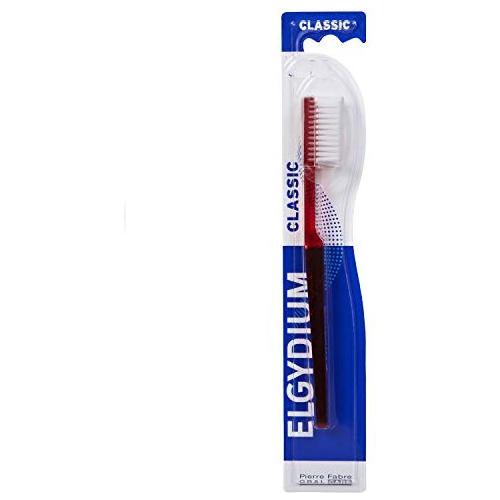 Elgydium Classic medium toothbrush in assorted colors with soft bristles, designed for effective dental cleaning.