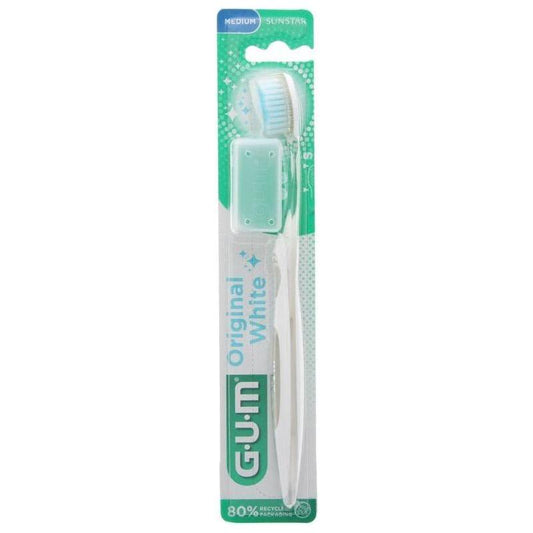 GUM Original White 563 medium toothbrush by Pasteur Pharmacy with assorted colored handles, suitable for daily oral hygiene.