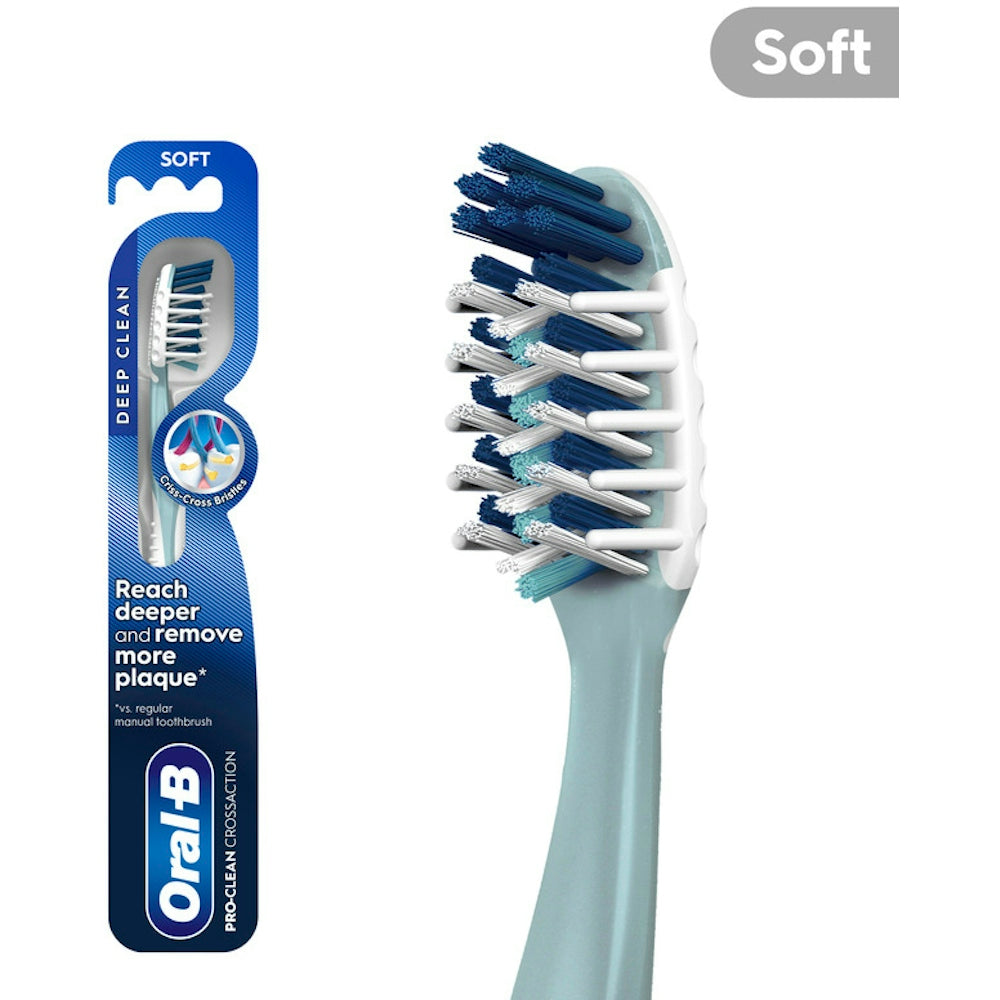Oral-B Cross Action All-In-One manual toothbrush with soft bristles, designed for effective cleaning and gum care.