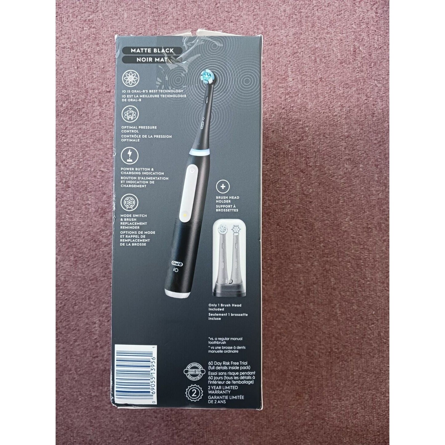Black Oral-B iO Series 3 Luxe rechargeable toothbrush with ergonomic design and brush head, ideal for effective teeth cleaning.