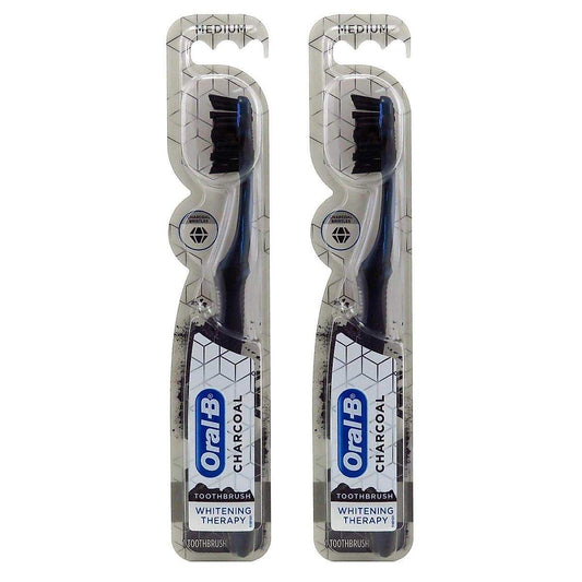 Oral-B charcoal toothbrush from Pasteur Pharmacy, medium whitening therapy, with a sleek handle and bristles designed for effective cleaning.