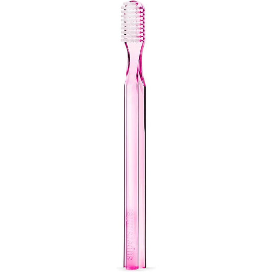 Supersmile professional pink toothbrush with ergonomic handle and soft bristles at a 45° angle, designed for effective dental cleaning.