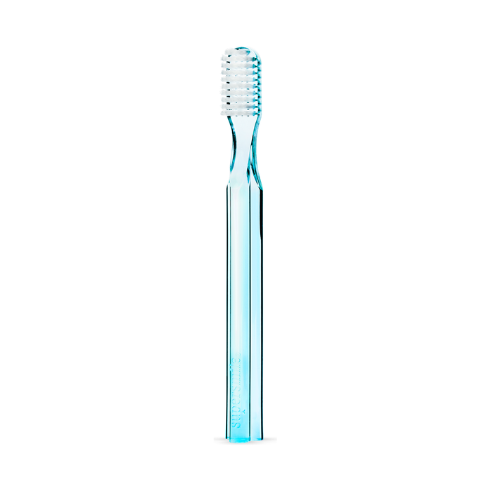 Blue Supersmile toothbrush with 45-degree ergonomic design for effective oral cleaning, featuring a sleek handle and soft bristles.