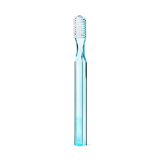 Blue Supersmile toothbrush with 45-degree ergonomic design for effective oral cleaning, featuring a sleek handle and soft bristles.