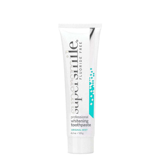Supersmile professional fluoride-free toothpaste in 4.2 oz tube, featuring a clean, white toothpaste with blue accents and branding.