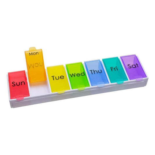 Colorful Ezy Dose Pill Organizer from Pasteur Pharmacy with rainbow compartments for travel medication storage.