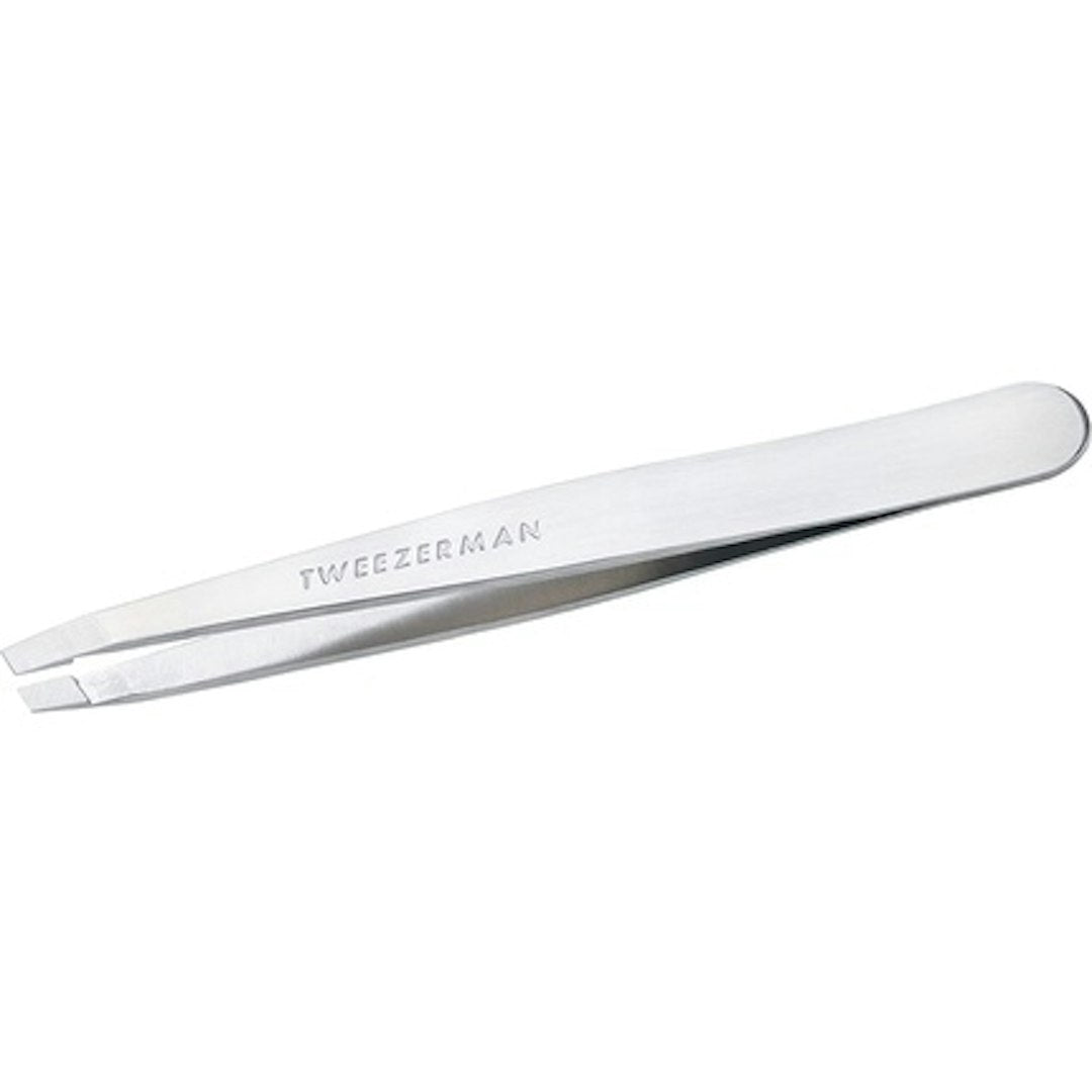 Tweezerman Platinum Silver Slant Tweezer with precise slant tip for easy eyebrow shaping, stainless steel design.