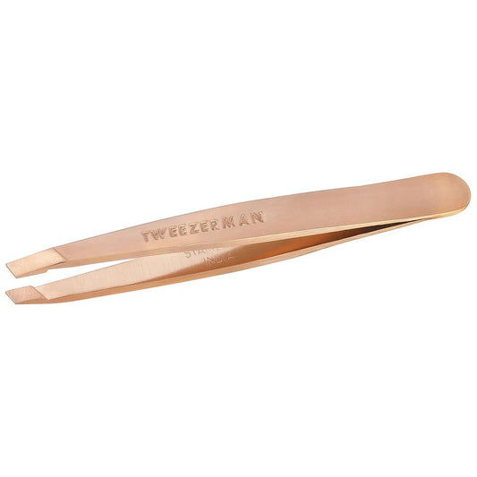 Rose gold mini slant tweezer by Tweezerman with precise angled tips for eyebrow shaping and hair removal.