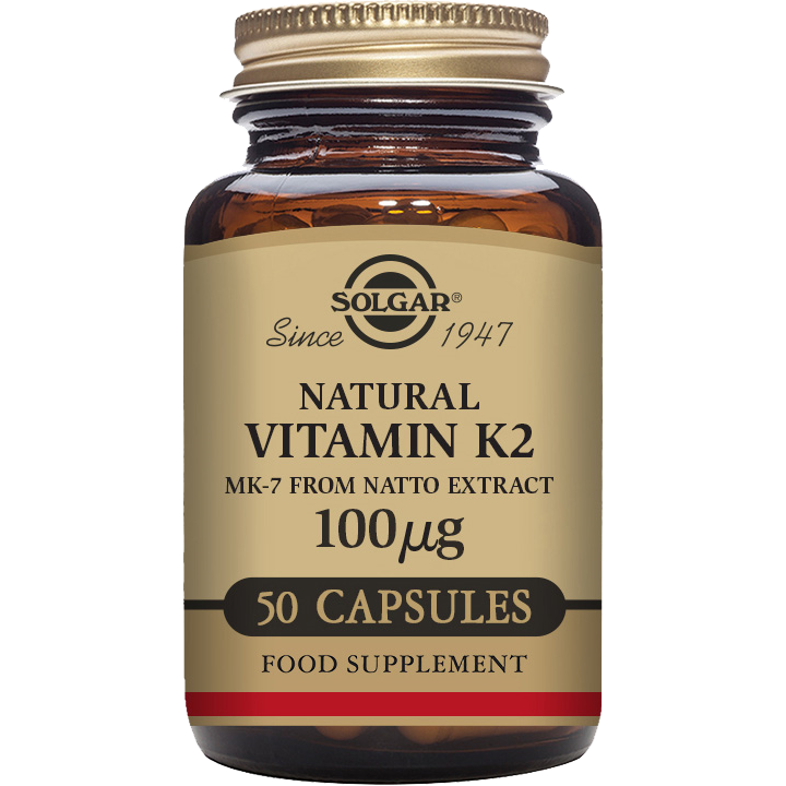 Solgar Vitamin K2 100 mcg supplement in 50 vegetable capsules, displayed in a clear container with label.