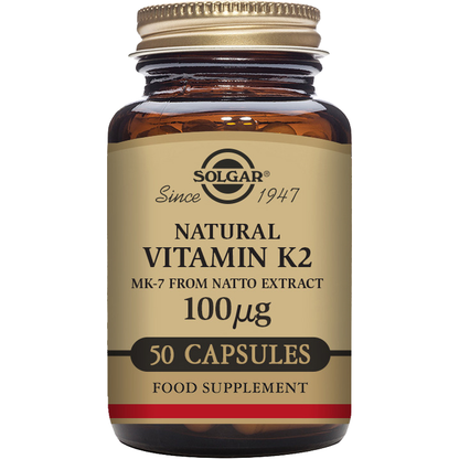 Solgar Vitamin K2 100 mcg supplement in 50 vegetable capsules, displayed in a clear container with label.